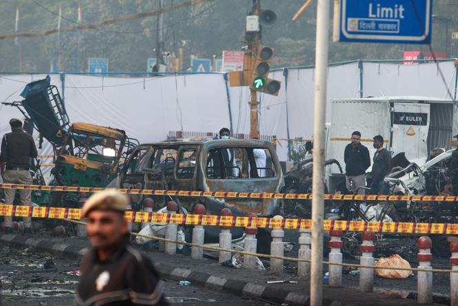 Investigators inspect the scene of a car explosion near the historic Red Fort in New Delhi, India, November 11, 2025. 