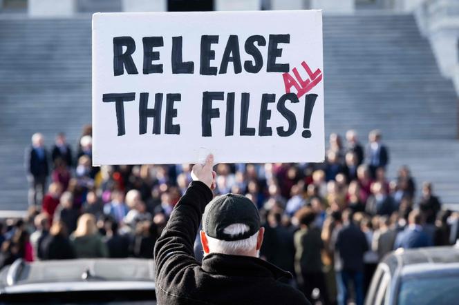 A protester holds a sign outside the US Capitol in Washington, DC, November 12, 2025.