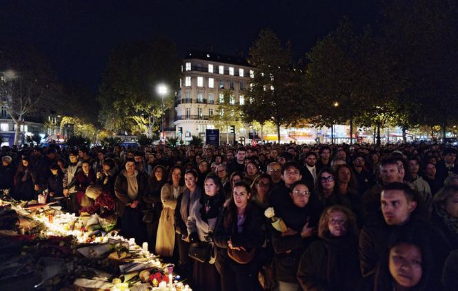 Thousands of people gather during a video of the November 13 park inauguration ceremony at the Place de la République, in Paris, on November 13, 2025.