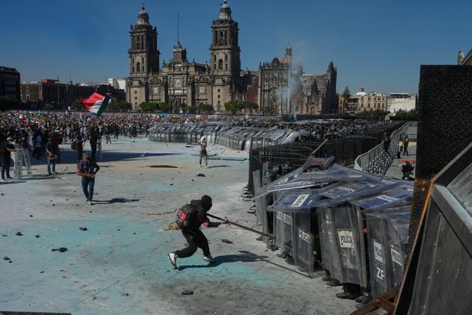 Protesters charge at the police during an anti-government rally organized by youth in Mexico City, November 15, 2025. 