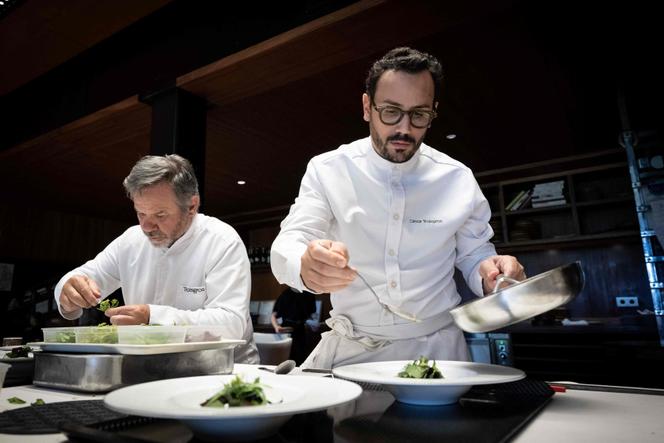 Cesar Troisgros (right) cooks with his father, Michel, at Bois Sans Feuilles, in Ouches (Loire), in 2023.
