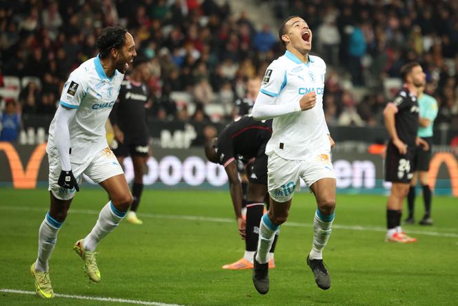 England Olympique Marseille striker No.10, Mason Greenwood (right), celebrates his team's third goal in the Ligue 1 match against OGC Nice, at the Allianz Riviera stadium in Nice, November 21, 2025.