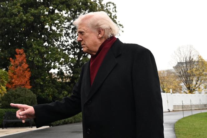 Donald Trump responds to reporters at the White House, November 22, 2025.