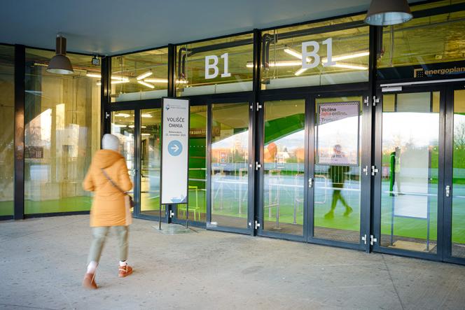 A voter arrives at a polling station to participate in a referendum on implementing or suspending a law legalizing assisted dying, in Ljubljana, November 23, 2025. 