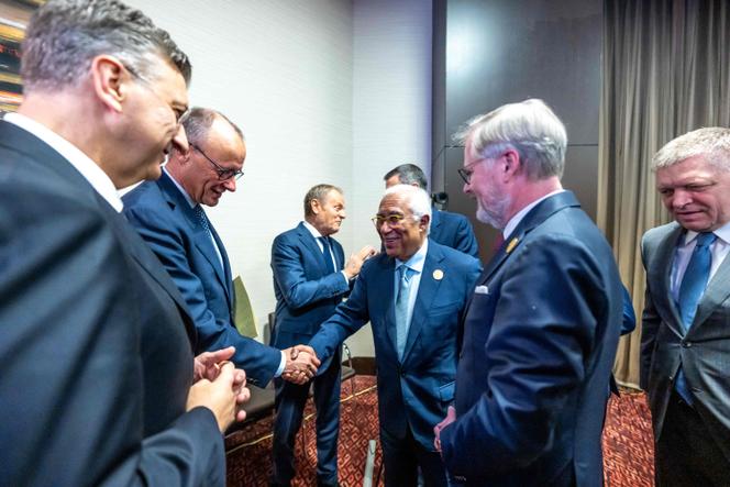 European Council President Antonio Costa (center picture) welcomes German Chancellor Friedrich Merz during the EU-African Union Summit, in Luanda, Angola, 24 November 2025.