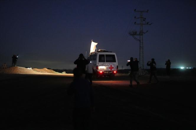 A Red Cross convoy carrying the body of a suspected Israeli hostage heads to the border crossing point with Israel, in Deir Al-Balah, in the central Gaza Strip, on November 25, 2025.