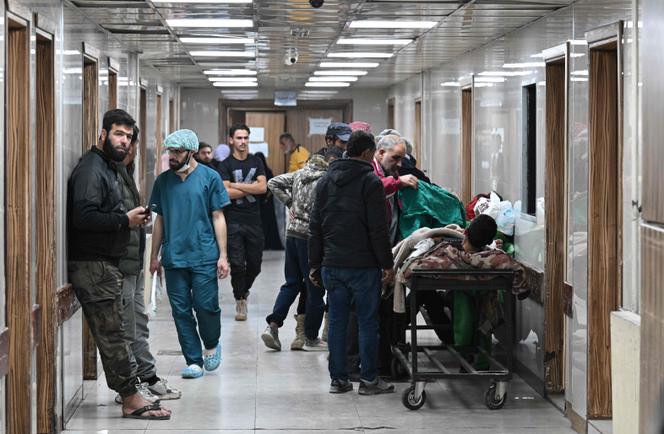 A man lies on a hospital bed at Al-Mouwasat Hospital in Damascus, following a operation by Israeli forces in the Syrian village of Beit Jin on November 28, 2025.