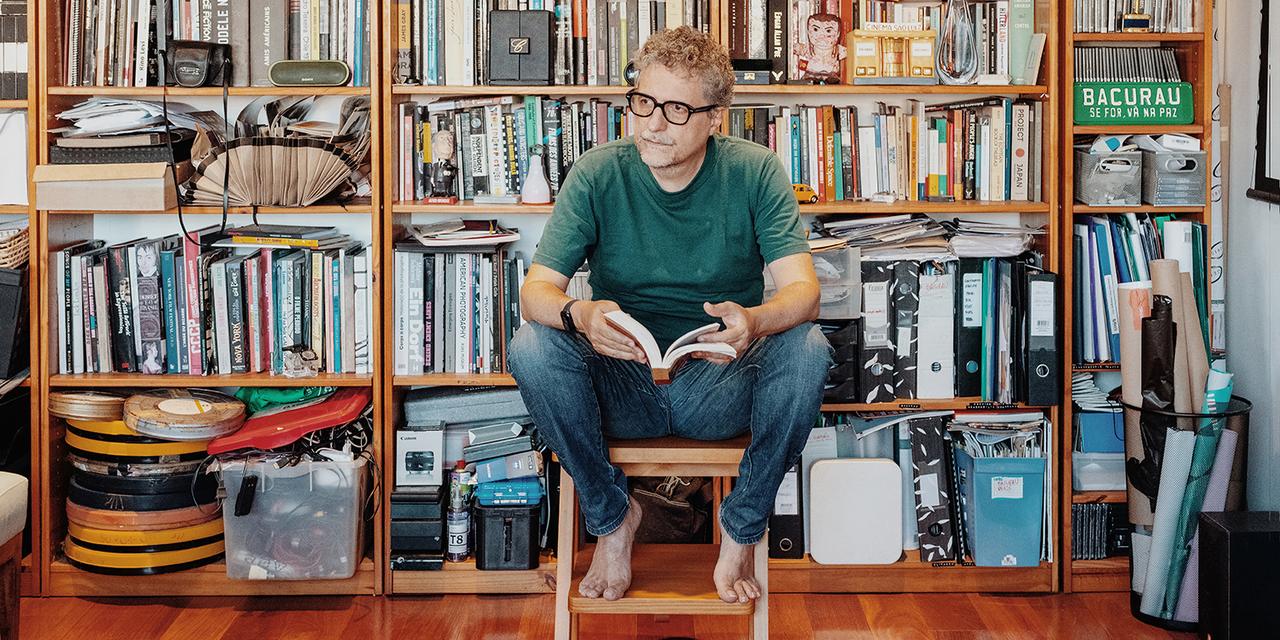 Kleber Mendonça Filho in his home office in Recife, where he keeps his books, film reels, photographs, scripts, projectors, and awards