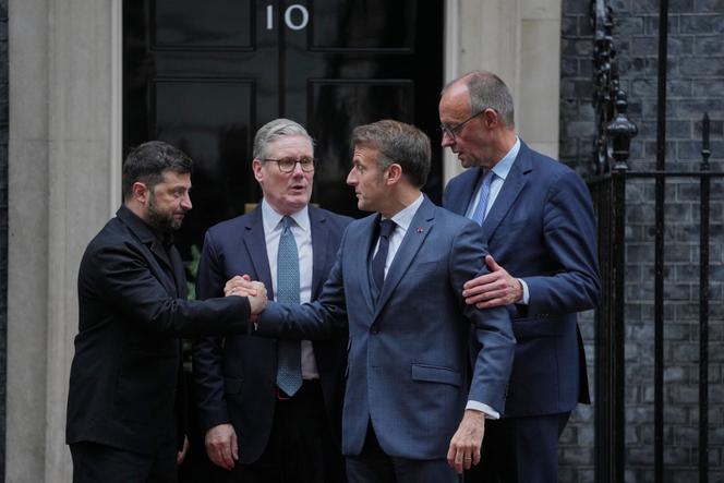 Ukrainian President Volodymyr Zelensky, left, with Britain's Prime Minister Keir Starmer, French President Emmanuel Macron, and German Chancellor Friedrich Merz pose on the doorstep of 10 Downing Street, London, on December 8, 2025.