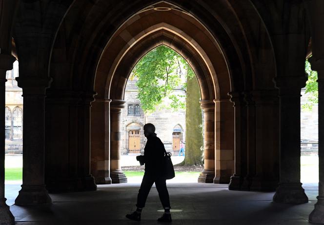 A student walks through the campus of Glasgow University complex in Scotland, on September 24, 2020.