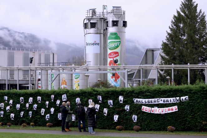 Portraits of Teisseire employees threatened with losing their jobs hang in front of the company's headquarters, in Crolles (Isère), on November 20, 2025.