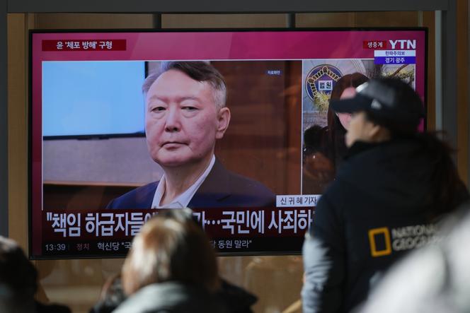 A TV screen shows a file footage of South Korea's ousted President Yoon Suk Yeol during a news program at the Seoul Railway Station in Seoul, South Korea, December 26, 2025.