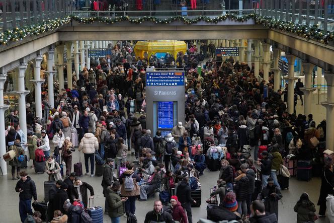 Passengers wait with luggage at St. Pancras International station in London, Britain, December 30, 2025. 