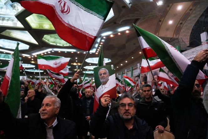 People wave Iranian flags in Tehran, Iran, on Thursday, January 1, 2026. 