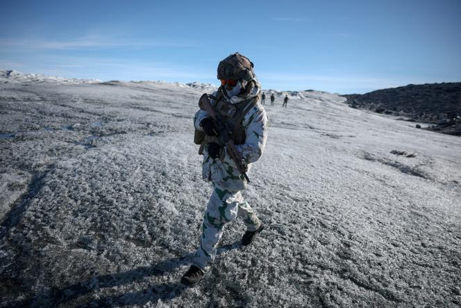 A member of the French armed forces walks on ice during a military drill in Kangerlussuaq, Greenland, September 2025.