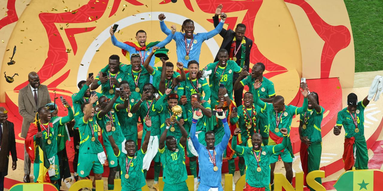 Senegal's Sadio Mane holds the trophy aloft as he celebrates with teammates after winning the Africa Cup of Nations final soccer match between Senegal and Morocco in Rabat, Morocco, Sunday, Jan. 18, 2026. (AP Photo/Youssef Loulidi)