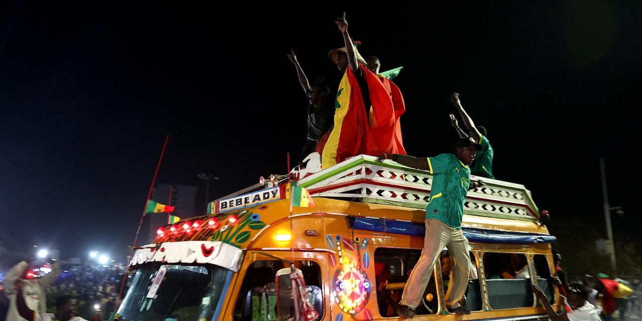 Soccer Football - CAF Africa Cup of Nations - Morocco 2025 - Final - Fans watch Senegal v Morocco - Dakar, Senegal - January 18, 2026
Senegal fans celebrate after winning the CAF Africa Cup of Nations REUTERS/Zohra Bensemra
