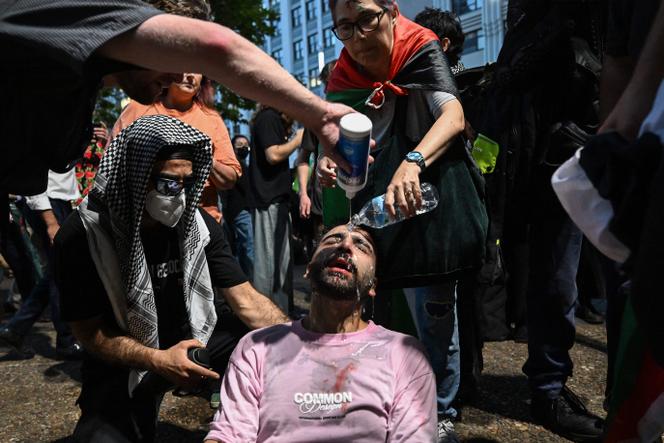 Un manifestant reçoit de l’aide après que la police a utilisé du gaz poivre lors d’un rassemblement propalestinien à Sydney (Australie), le 9 février 2026.