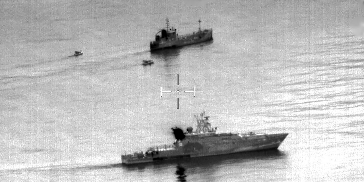 This undated handout photo released by the Marine Nationale (French Navy) and made available on February 5, 2026 shows a French Navy vessel approaching a suspect ship in the maritime zone of French Polynesia. The French Navy seized 4,249 tonnes of cocaine from a vessel in French Polynesia, the High Commission said in a statement on February 5, confirming a report by local channel TNTV. (Photo by Handout / Marine Nationale / AFP) / RESTRICTED TO EDITORIAL USE - MANDATORY CREDIT 