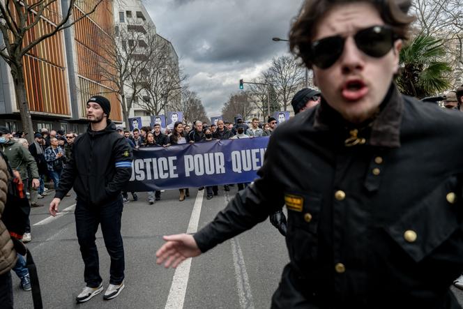 March in tribute to far-right activist Quentin Deranque, with neo-Nazi activist Marc de Cacqueray-Valmenier (left), in Lyon, February 21, 2026.