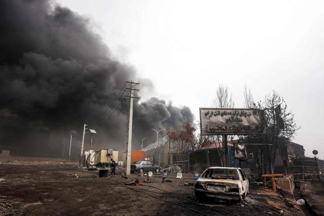 Smoke plumes rise from an ongoing fire following an overnight airstrike on the Shahran oil refinery in northwestern Tehran on March 8, 2026.