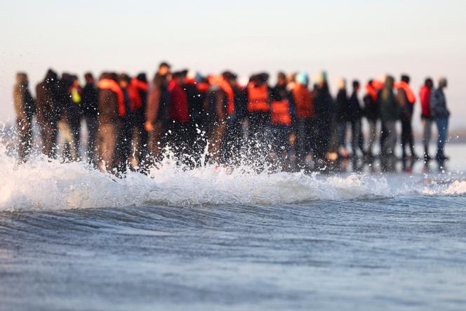 Migrants attempt to cross the English Channel to reach Britain, from a beach near Calais, France, September 27, 2025.