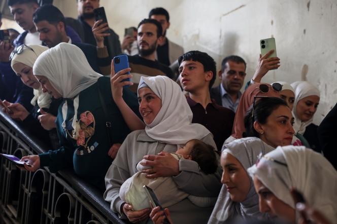 People gather during the first trial session of Atef Najib in Damascus, Syria, April 26, 2026. 