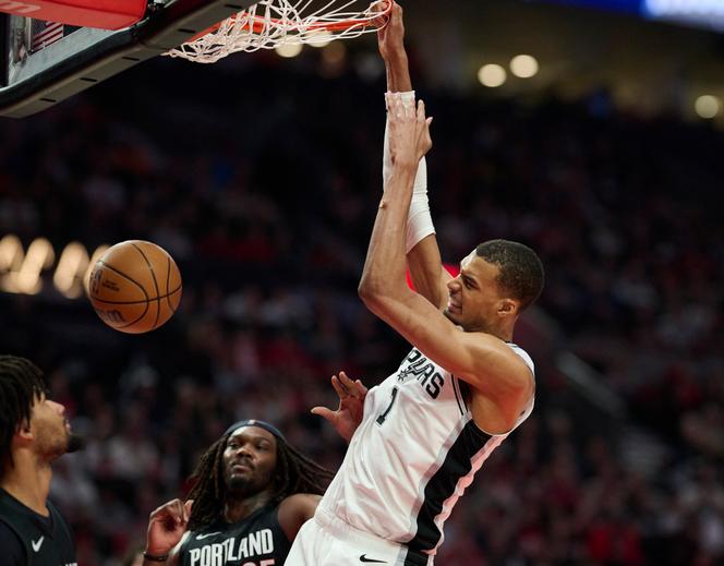 San Antonio Spurs forward Victor Wembanyama dunks the basketball during the second half against Portland on April 26, 2026.
