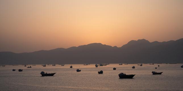 Iran warns of ceasefire violation as US plans to escort Hormuz ships