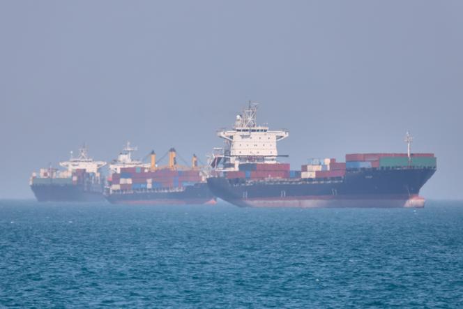 Container ships sit at anchor in the Strait of Hormuz off the coast of Bandar Abbas, Iran, on May 2, 2026.