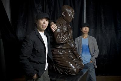 Chinese artist Gao Zhen (left) and his brother Gao Qiang in front of their work 'Mao's Guilt,' Beijing, September 22, 2009.