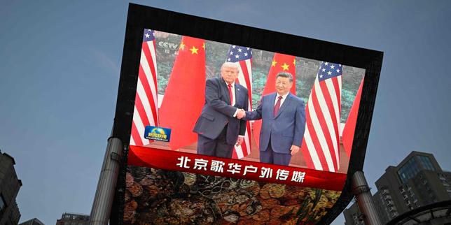 Donald Trump welcomed in Beijing with pomp and a stern warning