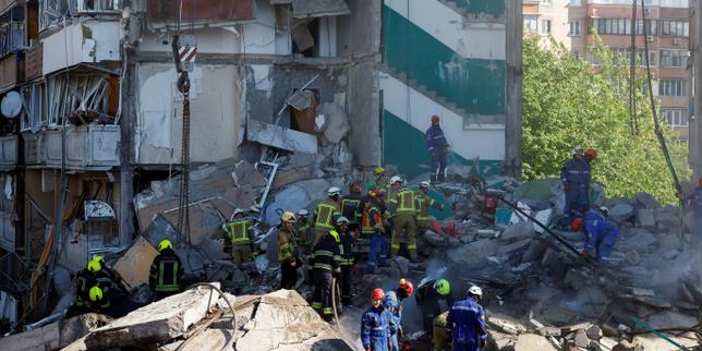 Russian barrage pounds Kyiv, killing more than a dozen