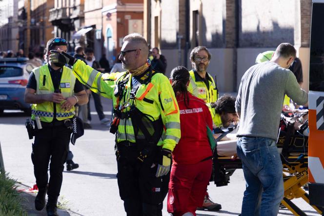Emergency workers work at the scene after a driver injured eight people by driving on a sidewalk, in Modena, Italy, May 16, 2026.