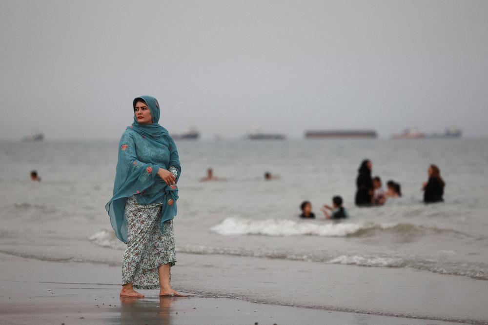 Des navires visibles dans le détroit d’Ormuz, vus depuis la plage de Bandar-e Abbas, en Iran, le 22 mai 2026. - MAJID ASGARIPOUR/WANA (WEST ASIA NEWS AGENCY)/ REUTERS