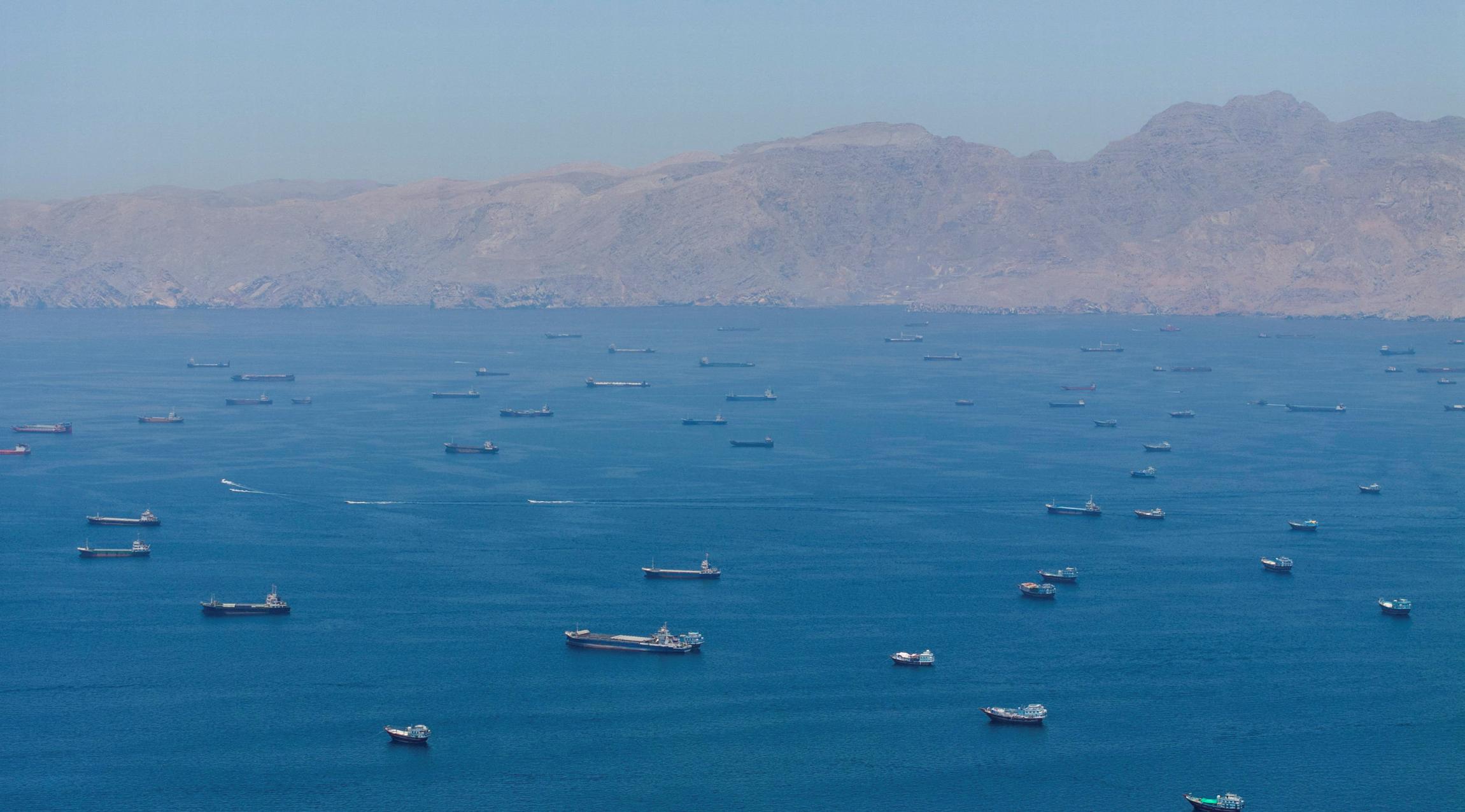 An aerial view, shot by drone, shows vessels anchored in the Strait of Hormuz, seen from Musandam, Oman, on May 25, 2026. REUTERS
