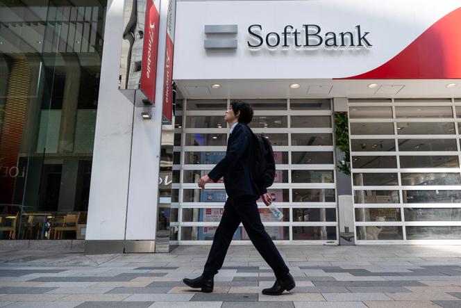A man walks past a SoftBank store in Tokyo on May 13, 2026.