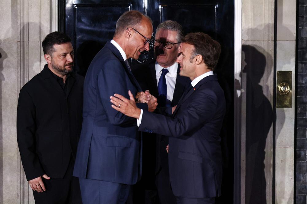 Volodymyr Zelensky, Friedrich Merz, Keir Starmer et Emmanuel Macron, au 10 Downing Street, à Londres, le 7 juin 2026. - HENRY NICHOLLS/AFP