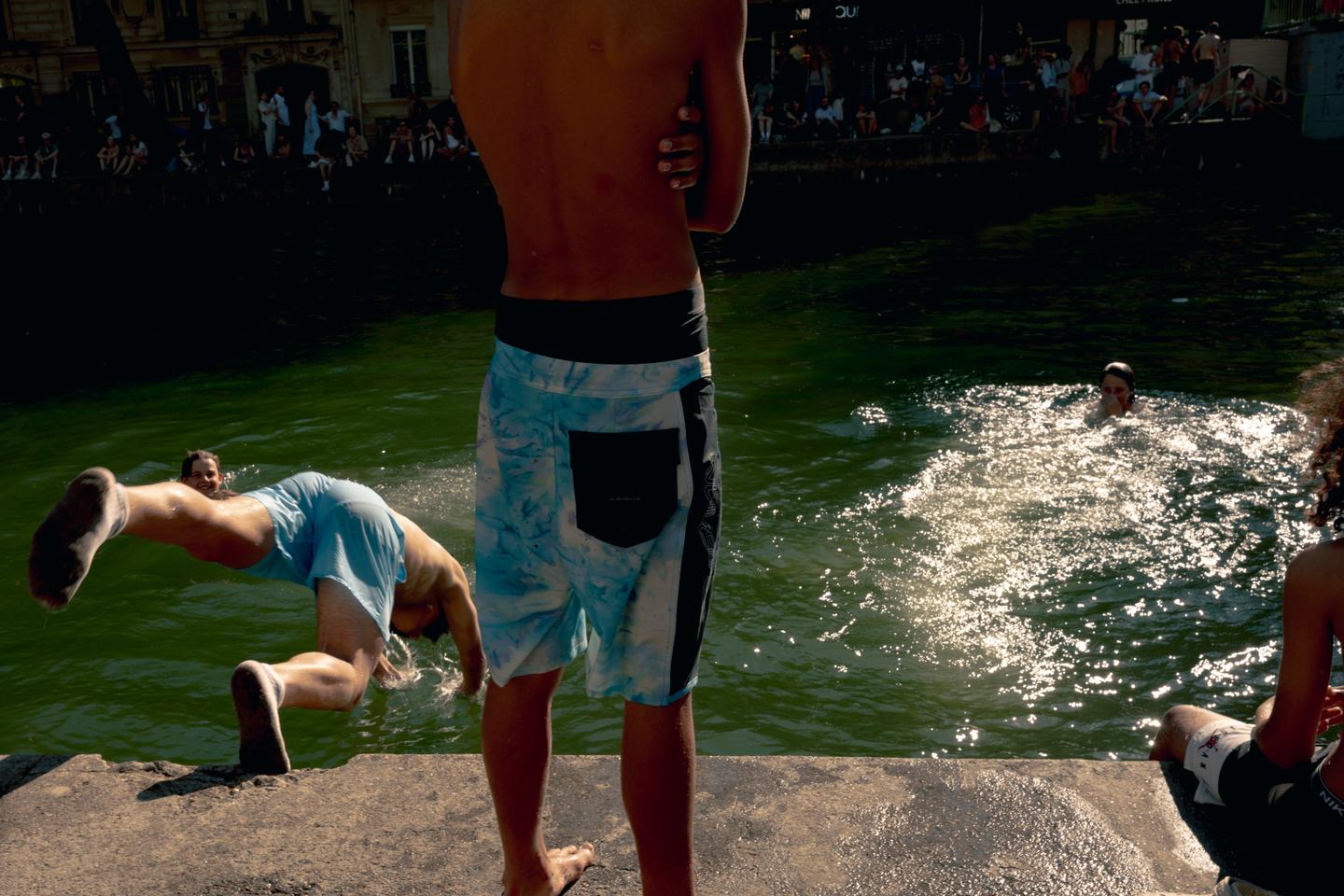 As Parisians seek heatwave relief, canal swimming proves difficult to supervise
