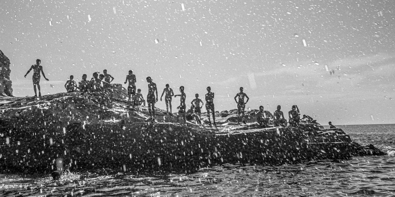TUNISIA. Bizerte. Cap Zebib. 2023. Young people swim in the sea.
