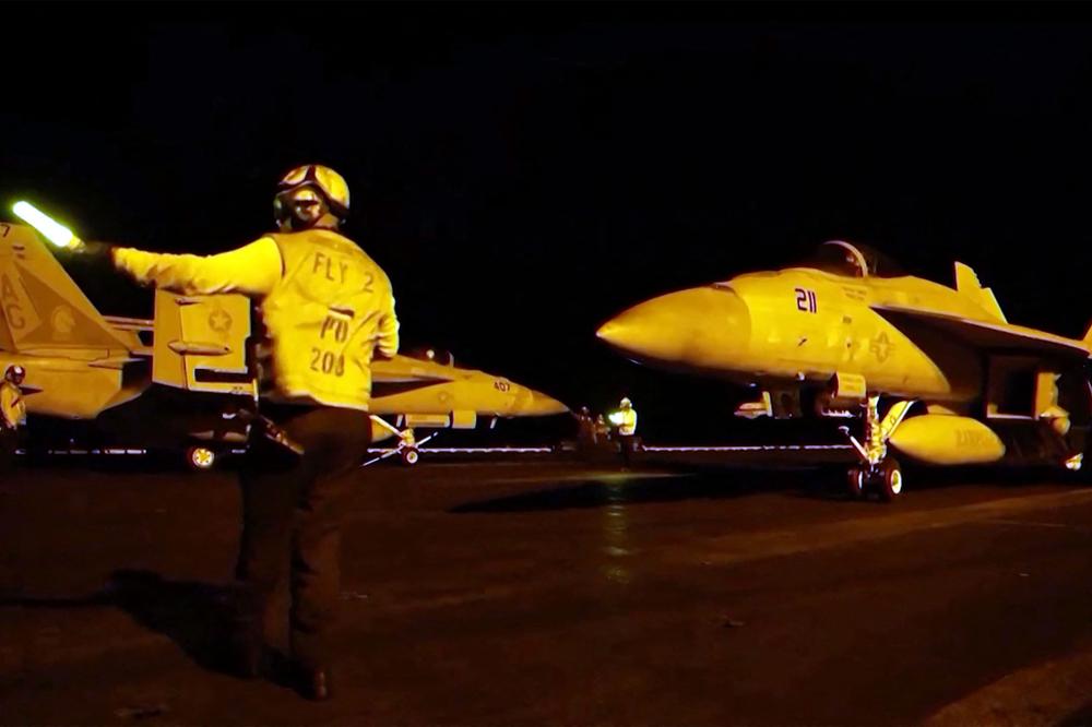 Les forces américaines lançant ce que l’armée décrit comme des frappes de précision visant des capacités militaires iraniennes, dans un lieu non identifié, dans la nuit du 21 au 22 juillet 2026. - - / AFP