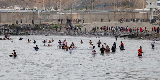 European leaders react as 60,000 migrants cross border into Spanish enclave