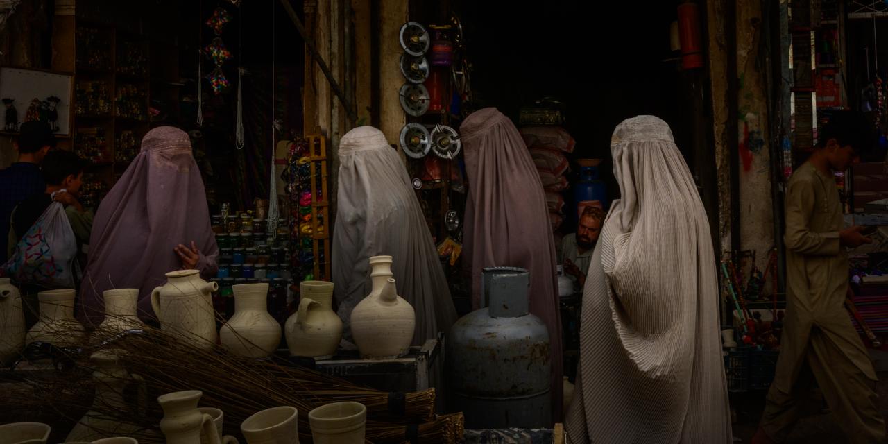  Women walk in the streets of Kandahar city, in southern Afghanistan, on May 27, 2023 (Photo by Elise Blanchard for The Washington Post).