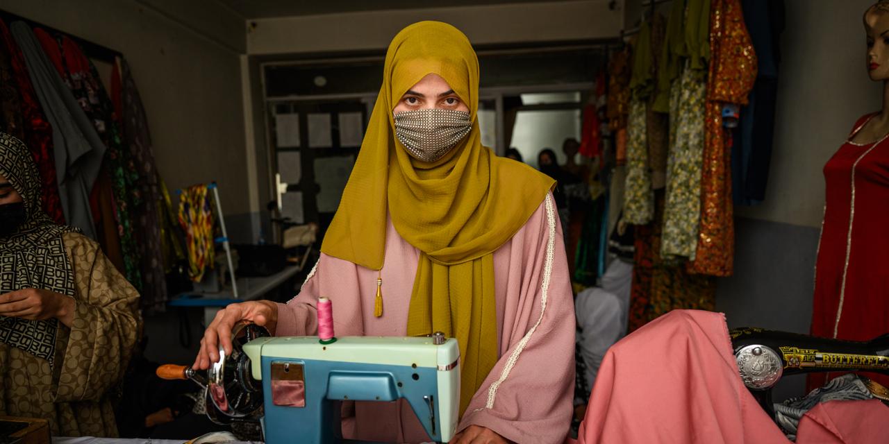 Khatima Salehi, the head of a tailoring workshop, works in her store, located in a women-only market in Faizabad, the capital of Badakhshan province, on March 24, 2025. Many of her trainees have turned to learning the trade as they could not continue high school because of Taliban rule. Salehi says she decided to open her workshop in order to provide opportunities for women and girls who were suffering from the Talibans’ bans. With it, she hopes to help them gain financial independence but also help those who fight depression and other mental health challenges as a result of schools closures, staying at home and isolation.