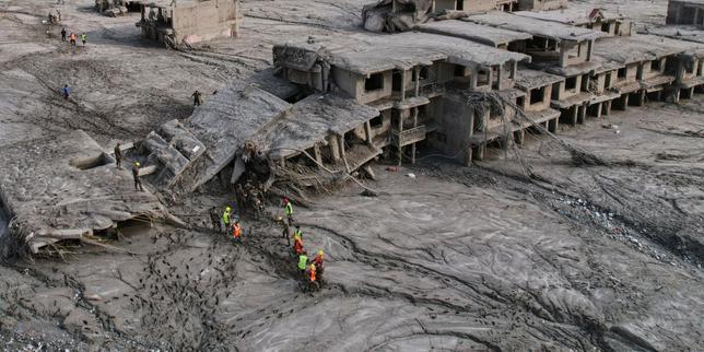 Rescuers dig into tunnel with hopes to rescue dozens as missing toll from Nepal, China flood nears 3,000