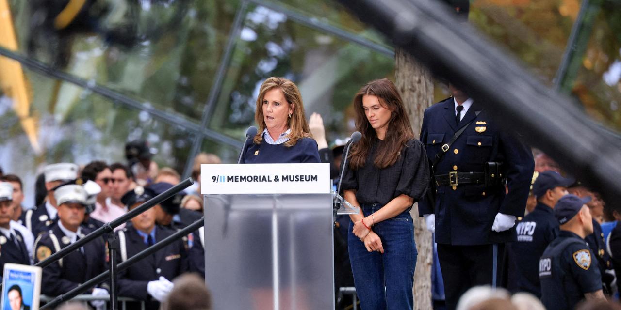Terry Strada, National Chair of 9/11 Families United, speaks at the podium during a ceremony marking the 25th anniversary of the September 11, 2001 attacks on the World Trade Center, in New York City, U.S., September 11, 2026. REUTERS/Brendan McDermid REFILE - ADDING ID