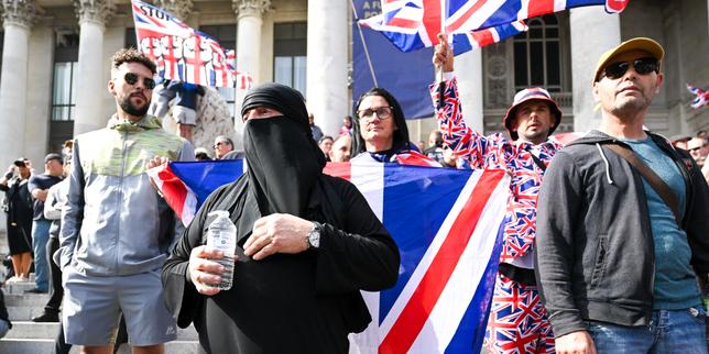 Why Britain Is Cracking Down On Masks And Face Coverings In Public