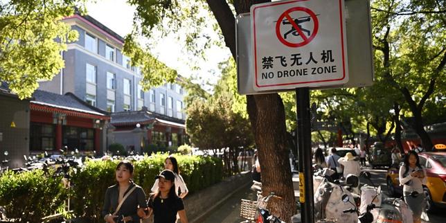 Les habitants de Pékin disent adieu à leurs drones