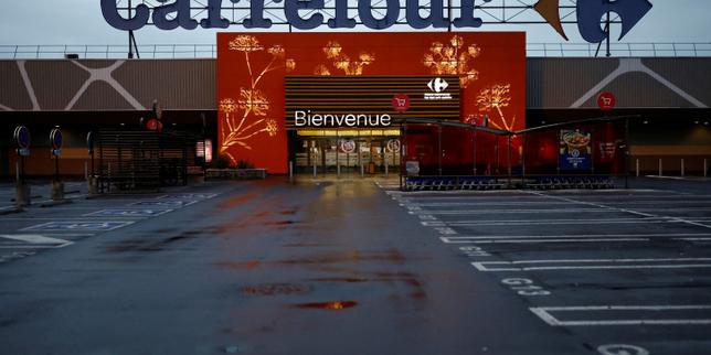 Carrefour shares plunge after profit warning on French protests