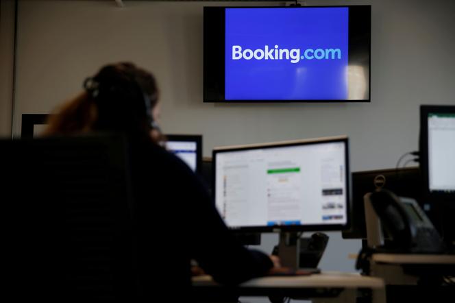 An employee works on his computer at the new Booking.com customers site in Tourcoing, France, October 4, 2019.  - PASCAL ROSSIGNOL/REUTERS